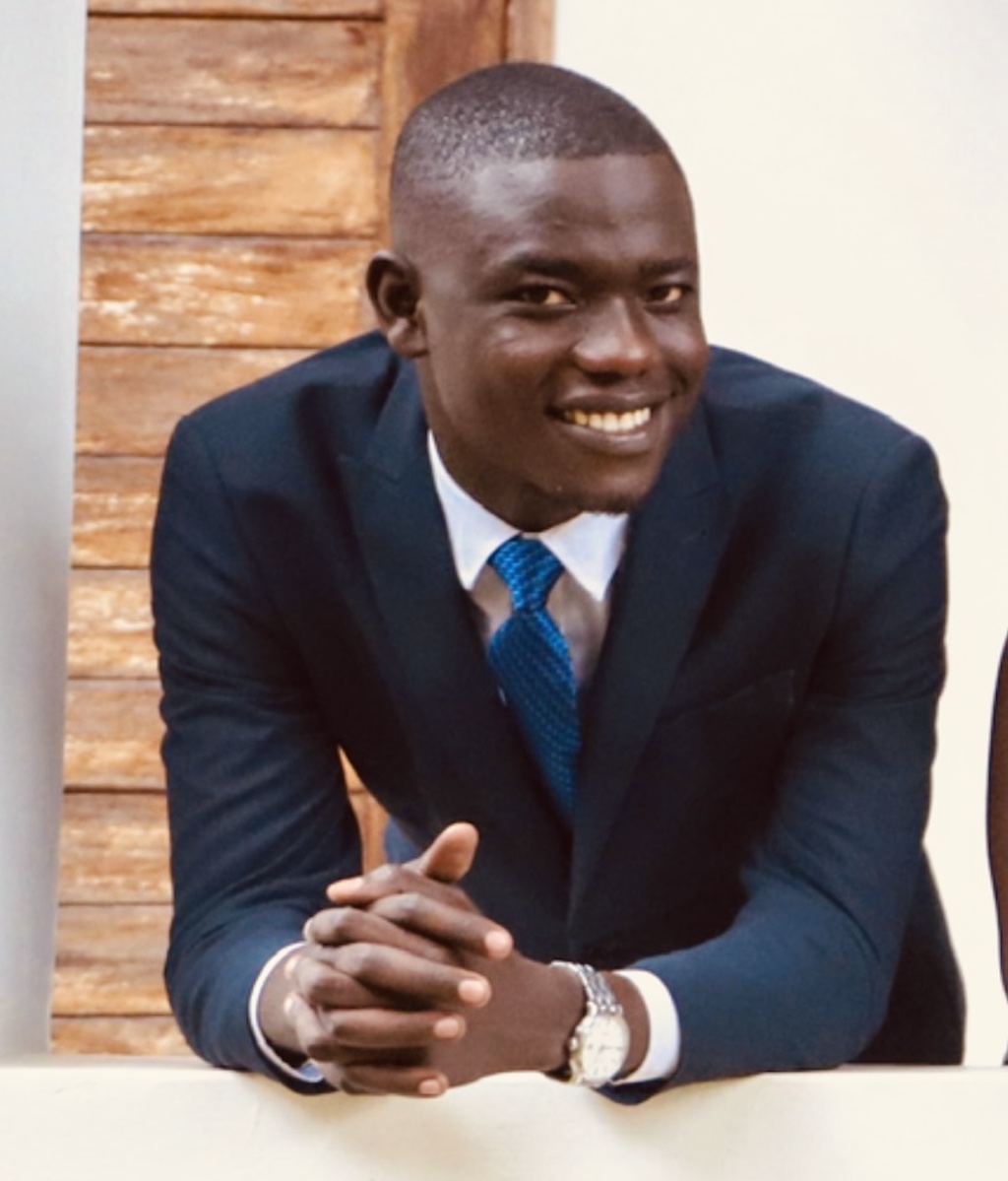 Young man leaning on the staircase railing