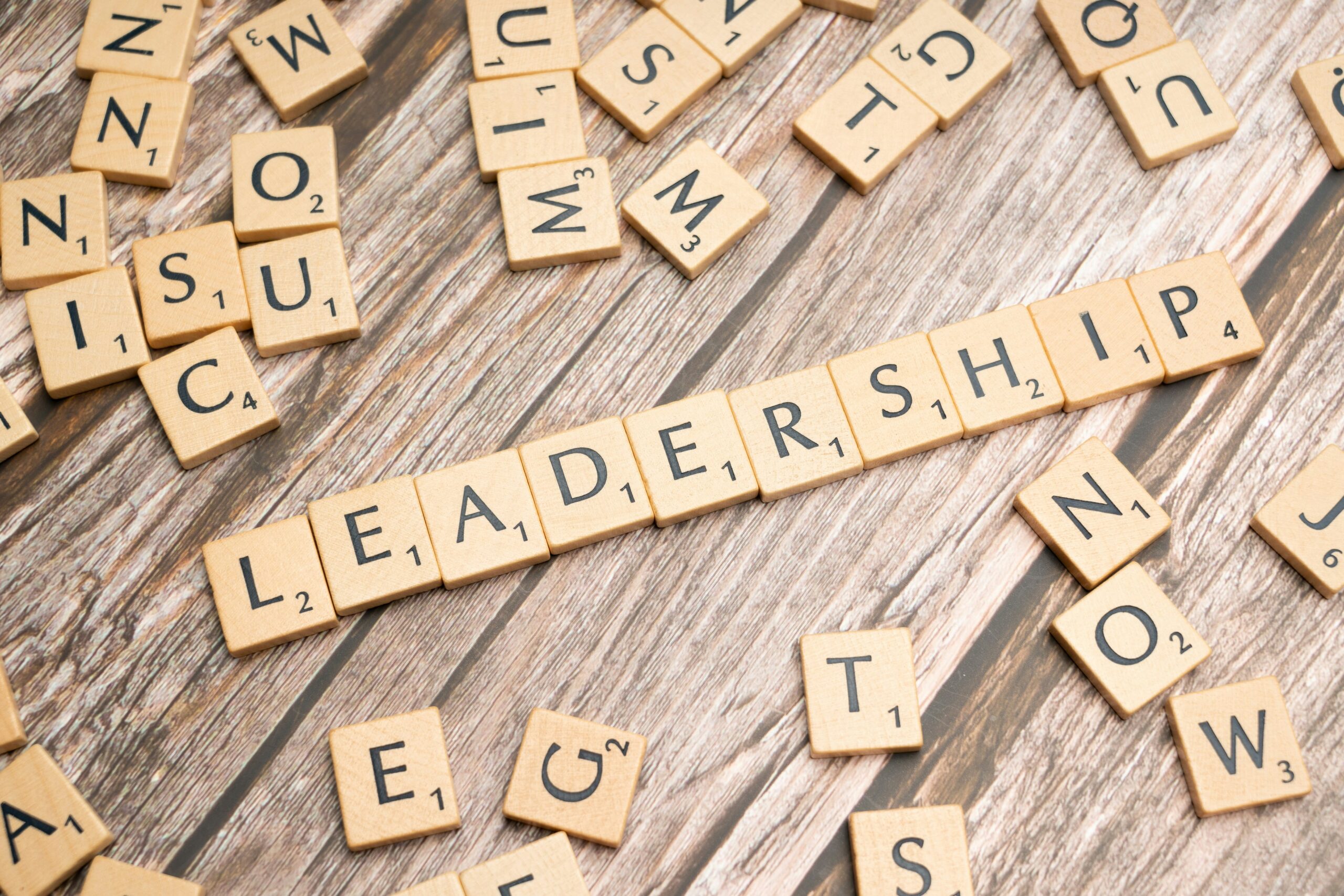 Scrabble blocks on a wood background spell out "Leadership" – Photo by Markus Winkler on Unsplash